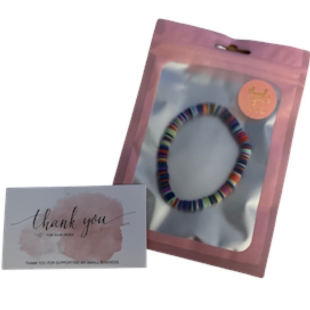 BRACELET. Splash of summer/multicolored clay disc stretch bracelet.